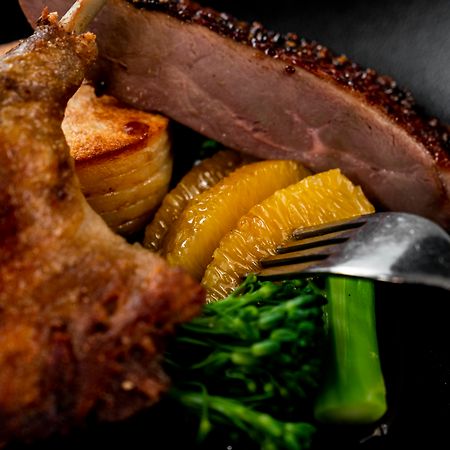 The Point Brisbane Hotel Eksteriør billede A duck confit with orange and vegetables
